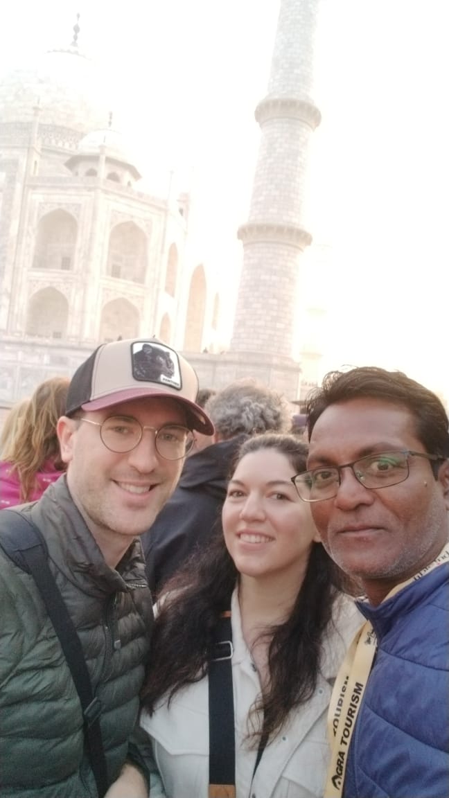Mr. Verma with tourists smiling